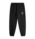Black fleece joggers featuring an "i am u" graphic. 