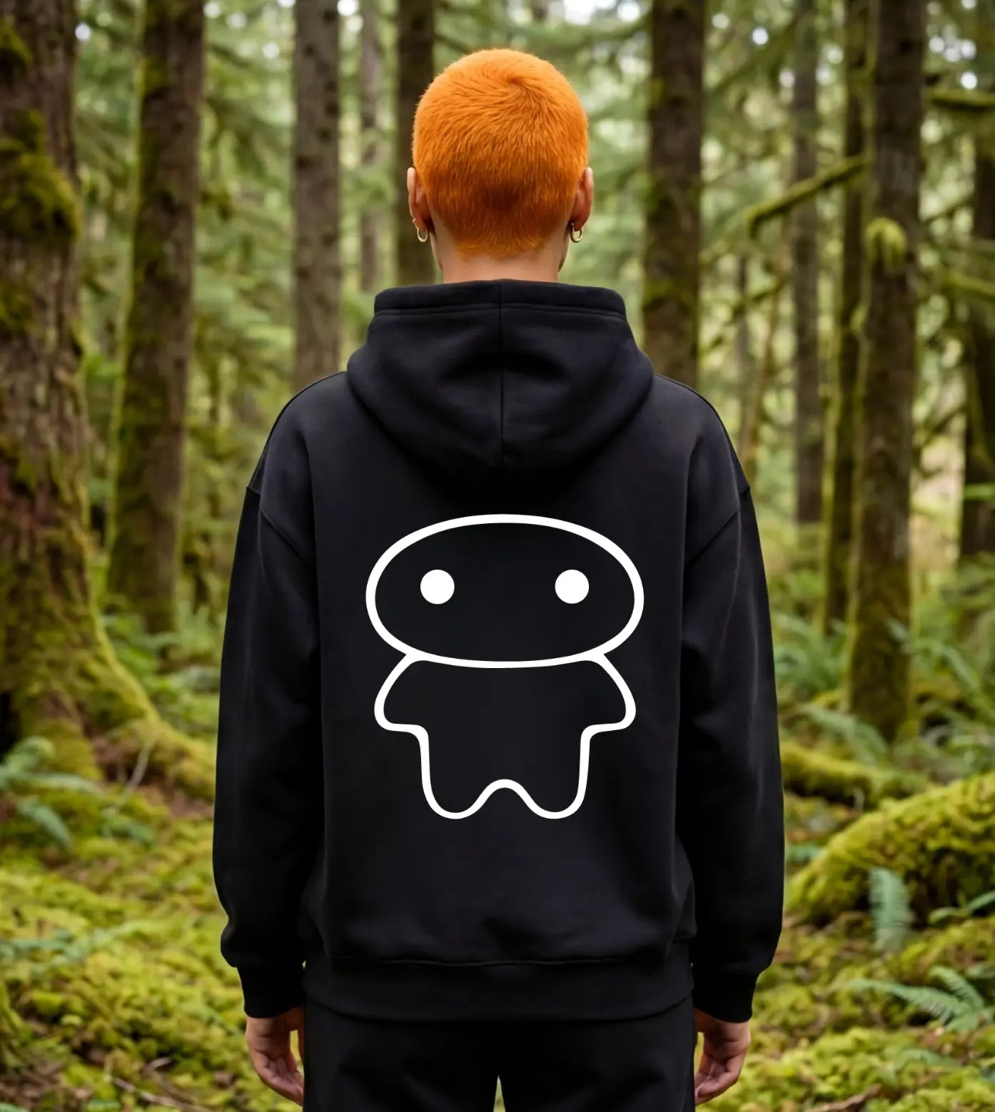 Model wears a black oversized fleece hoodie featuring a Lil Alien Bae back graphic. 