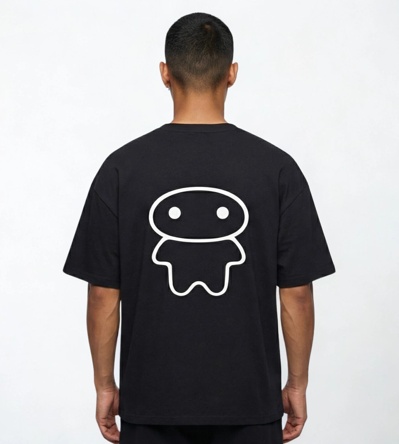 Model wears a black wide fit cotton T-shirt featuring a Lil Alien Bae back graphic. 