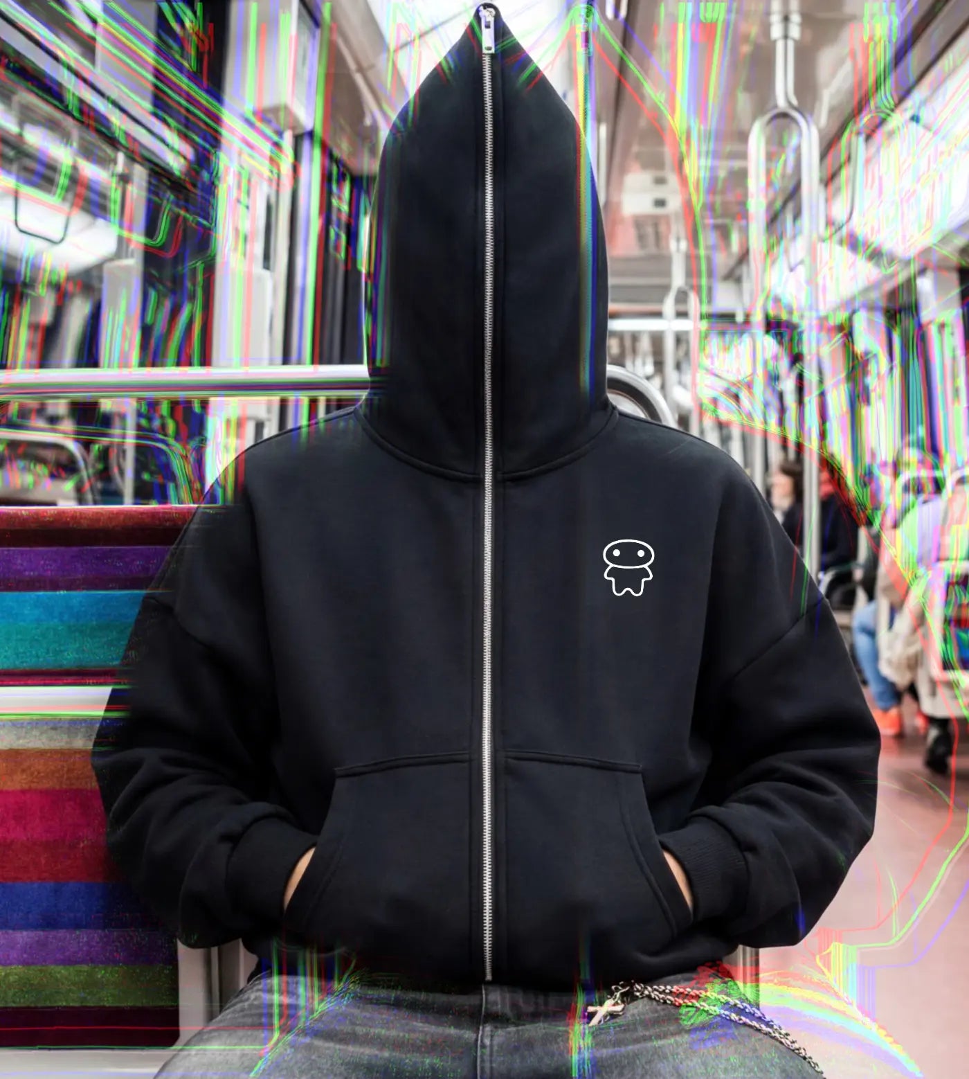 Model wears a black boxy fit full zip hoodie featuring a Lil Alien Bae chest graphic. 