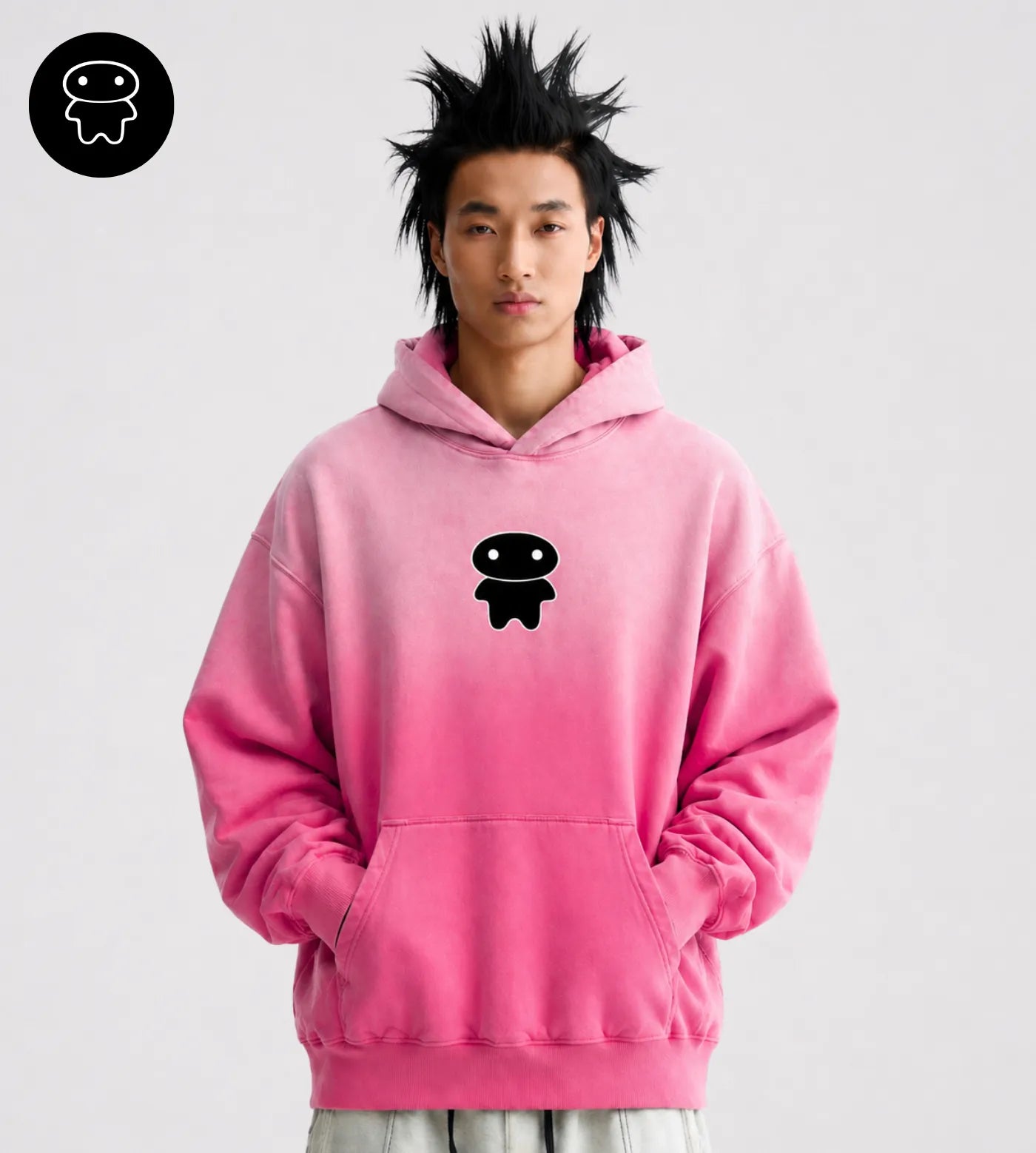 Model wears a hot pink sunfaded oversized hoodie featuring a black Lil Alien Bae graphic. 
