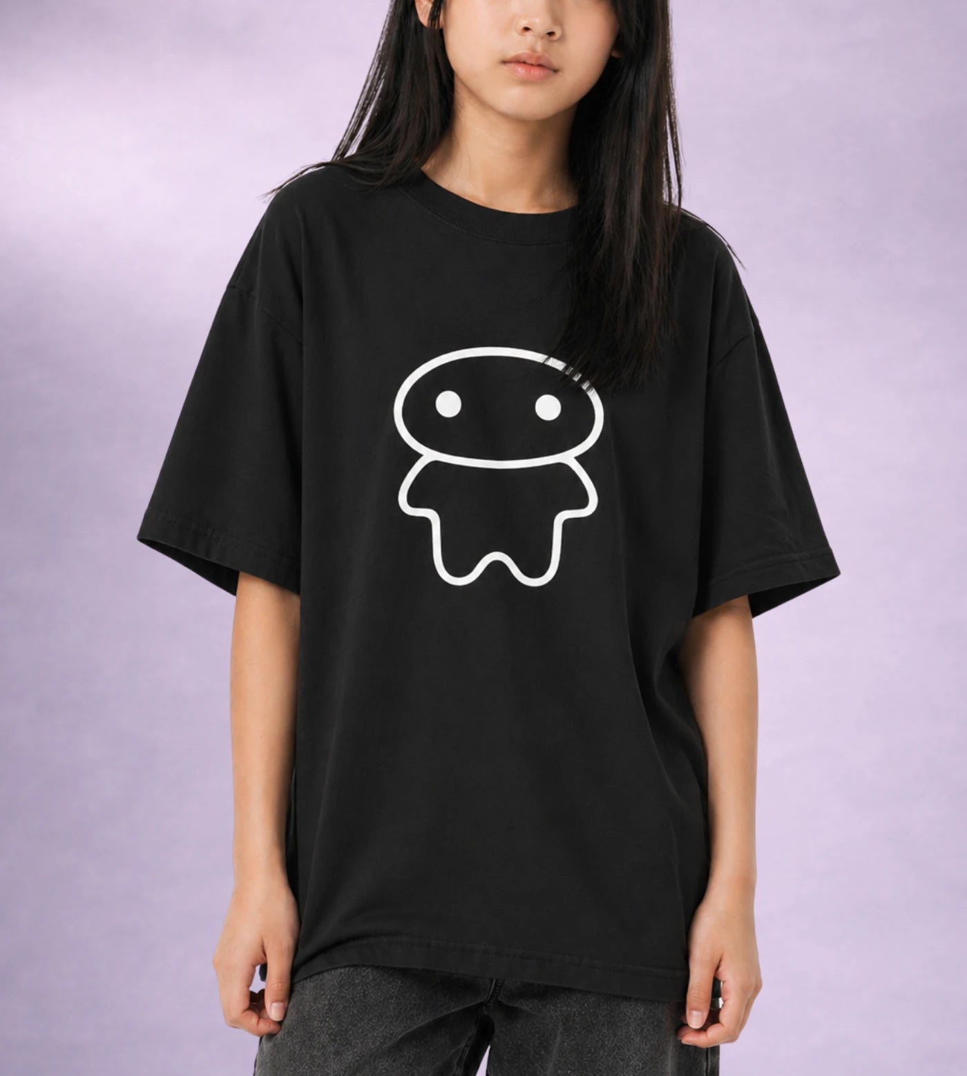 Model wears a youth black cotton T-shirt featuring a Lil Alien Bae graphic.