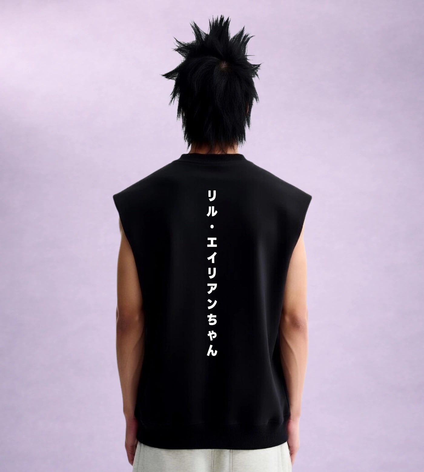 Model wears a black sleeveless cotton shirt featuring a Japanese Lil Alien Bae back graphic. 