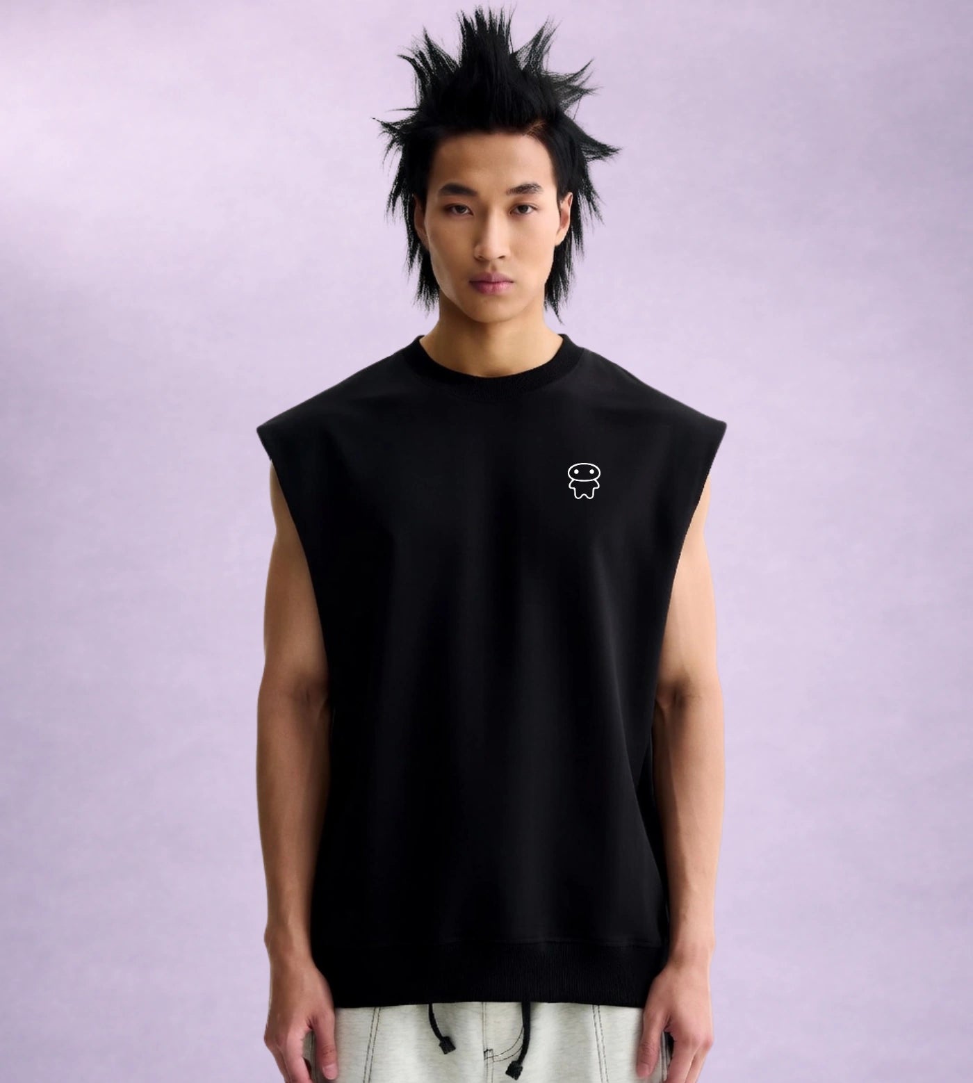 Model wears a black sleeveless cotton shirt featuring a Lil Alien Bae chest graphic. 