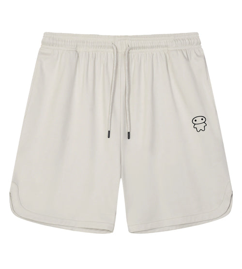 Off white athletic shorts featuring a Lil Alien Bae graphic. 