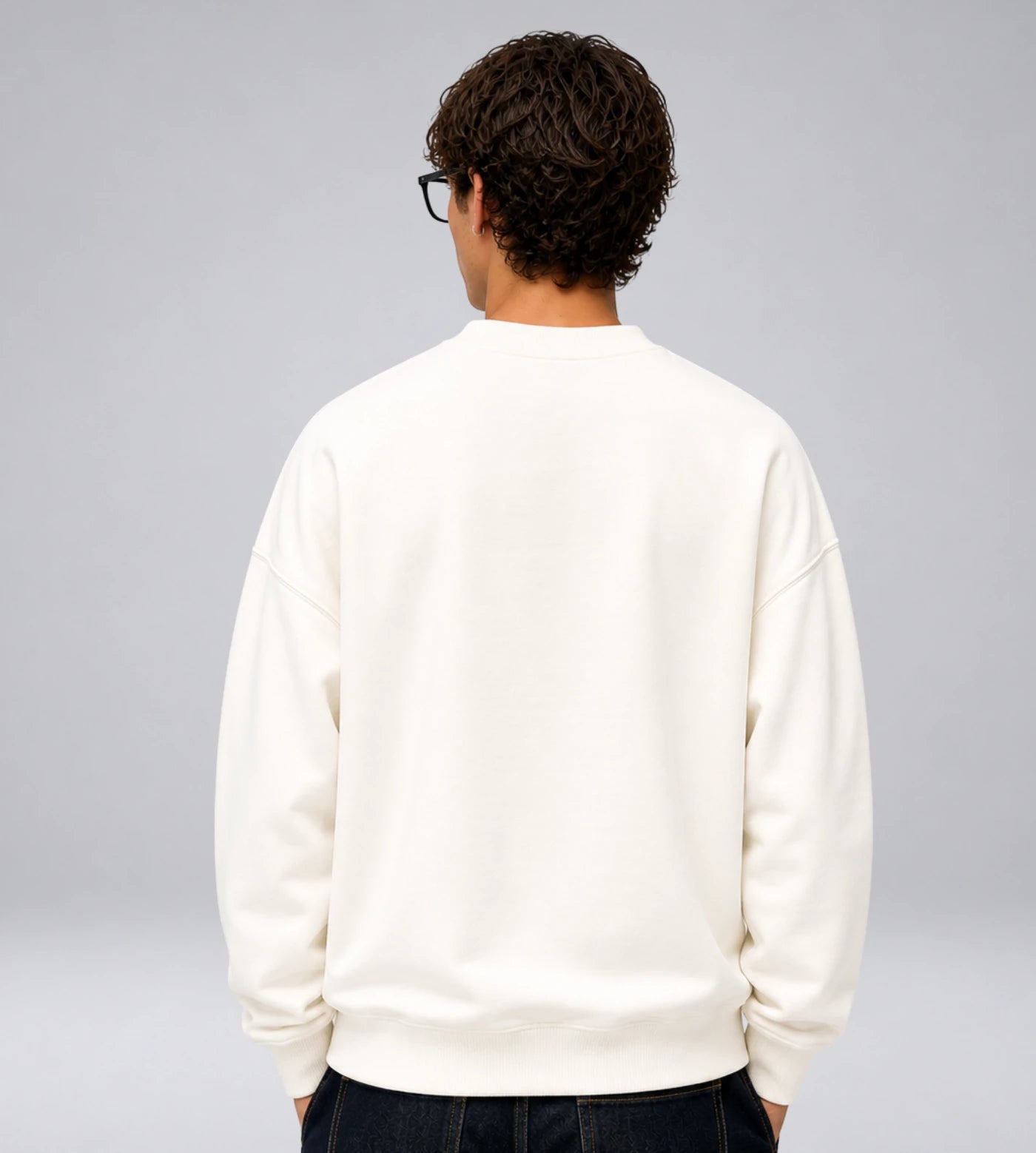 Model wears an off white heavyweight cotton sweatshirt.