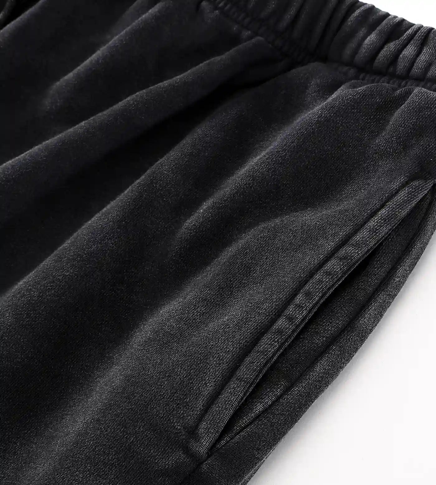 Black snow washed material, elastic waist, and pocket. 