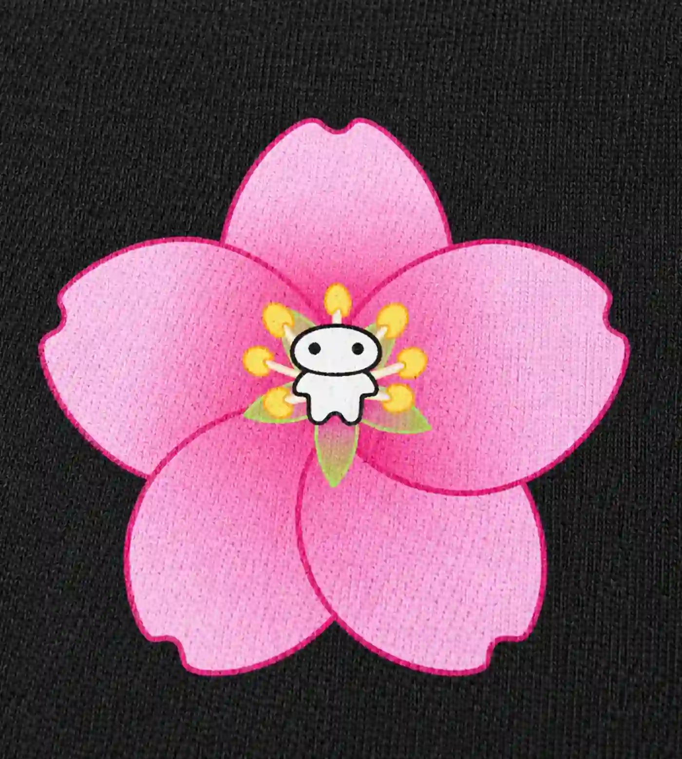 Close up details of Lil Alien Bae sakura chest graphic. 