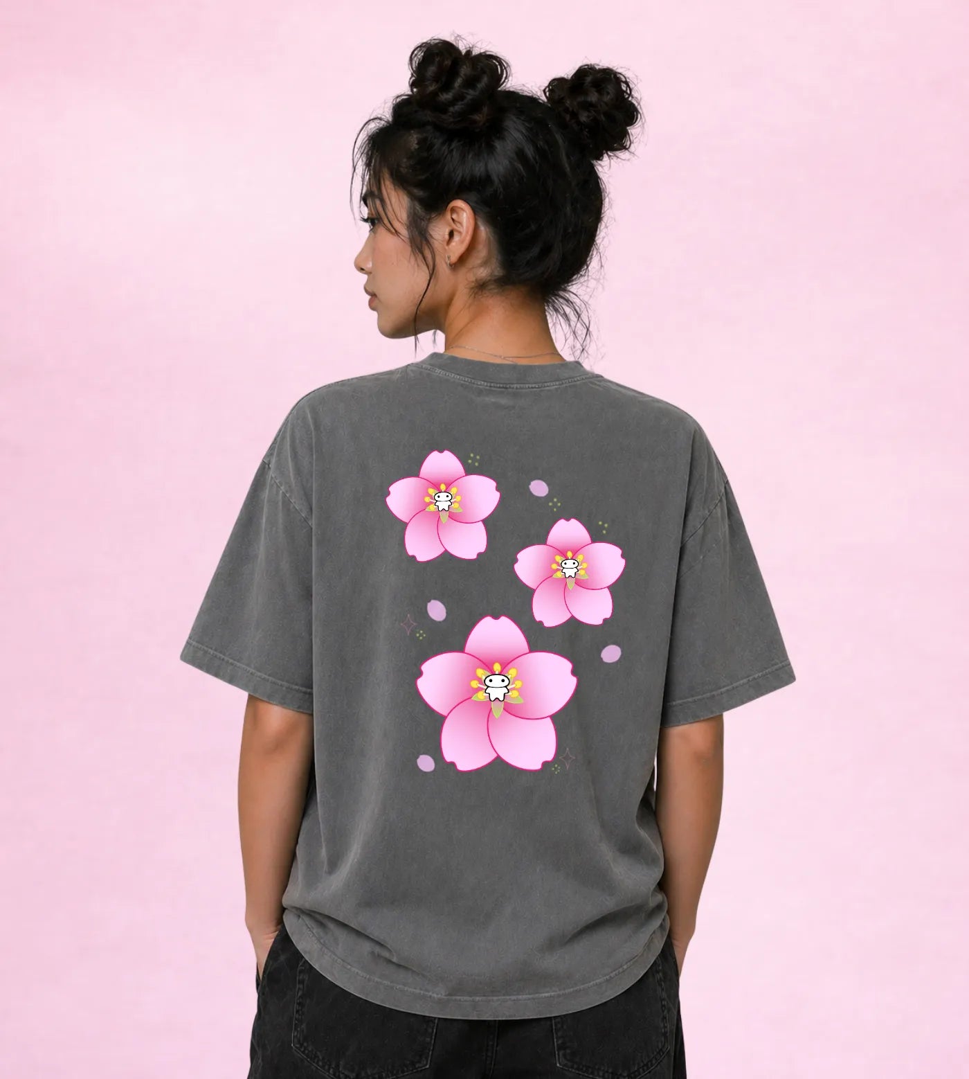 Model wears a gray vintage washed oversized cotton T-shirt featuring a Lil Alien Bae sakura back graphic.  