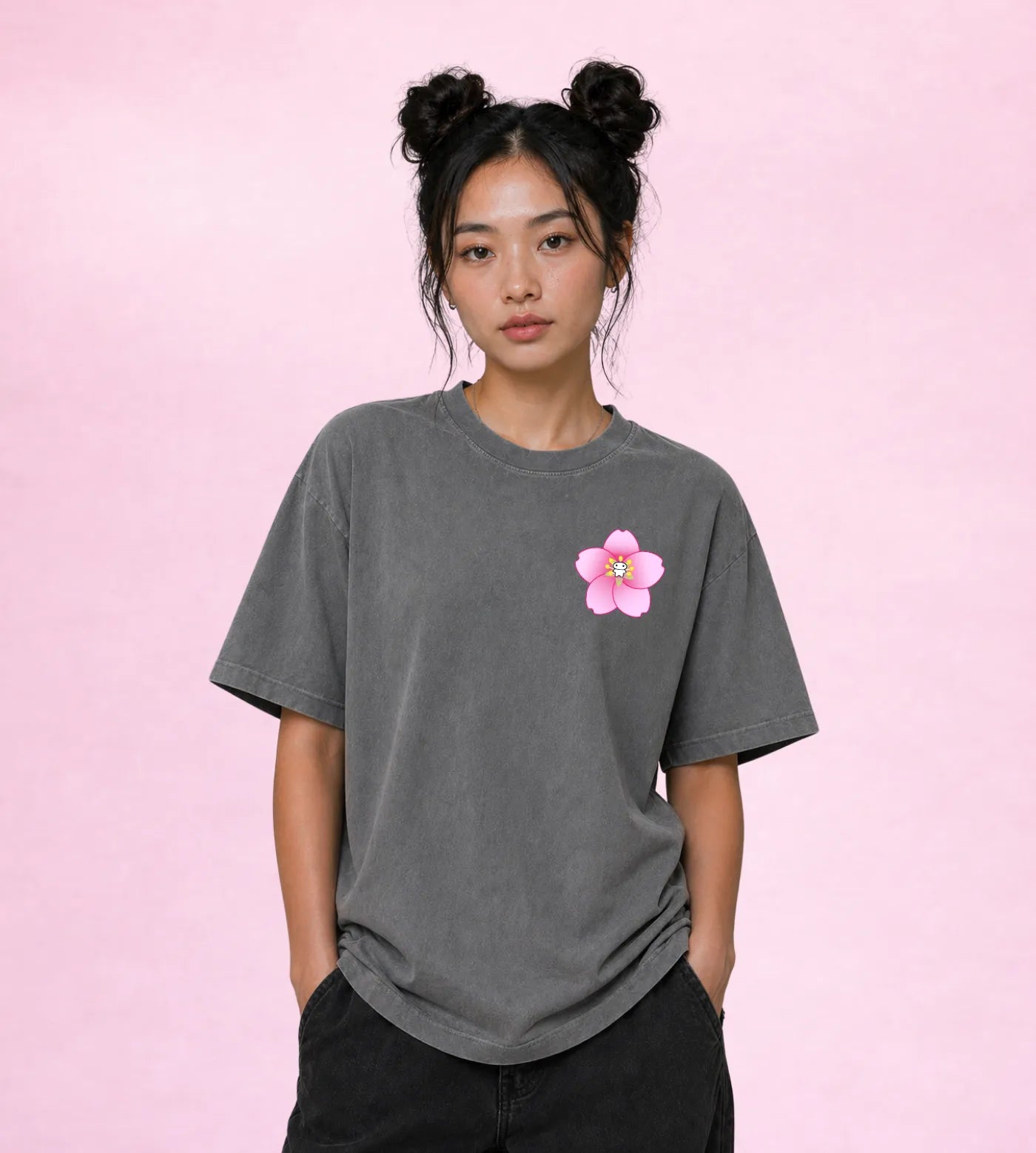 Model wears a gray vintage washed oversized cotton T-shirt featuring a Lil Alien Bae sakura chest graphic.  