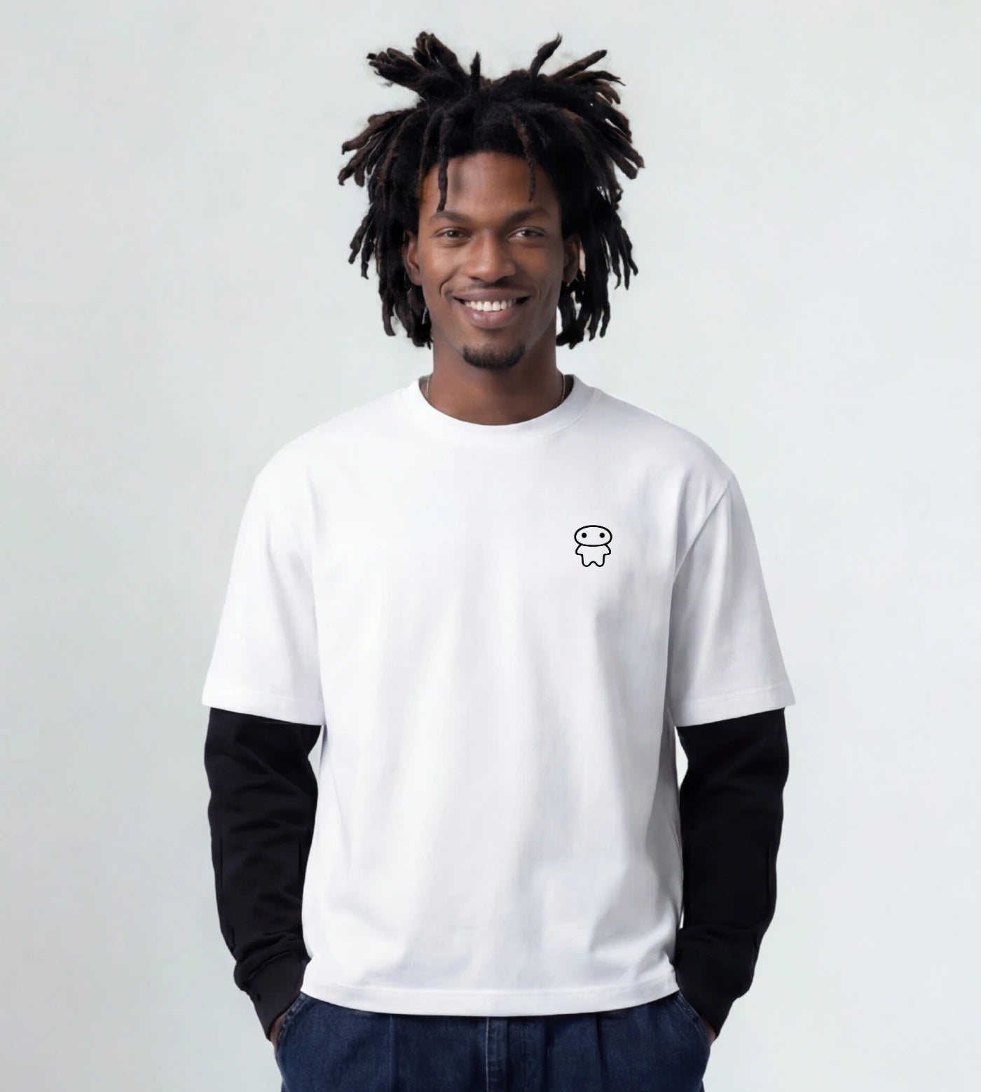 Model wears a white layered long sleeve T-shirt featuring a Lil Alien Bae chest graphic. 