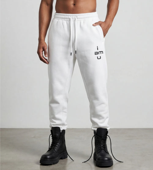 Male model wears white fleece joggers featuring an "i am u" graphic.  