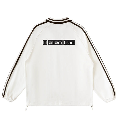 Off white lapel collar pullover featuring a Lil Alien Bae back graphic.