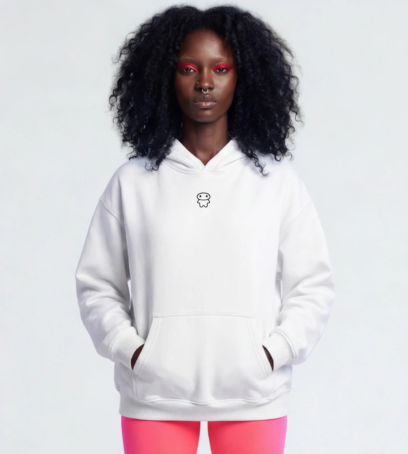 Model wears a white oversized fleece hoodie with a small Lil Alien Bae graphic.  