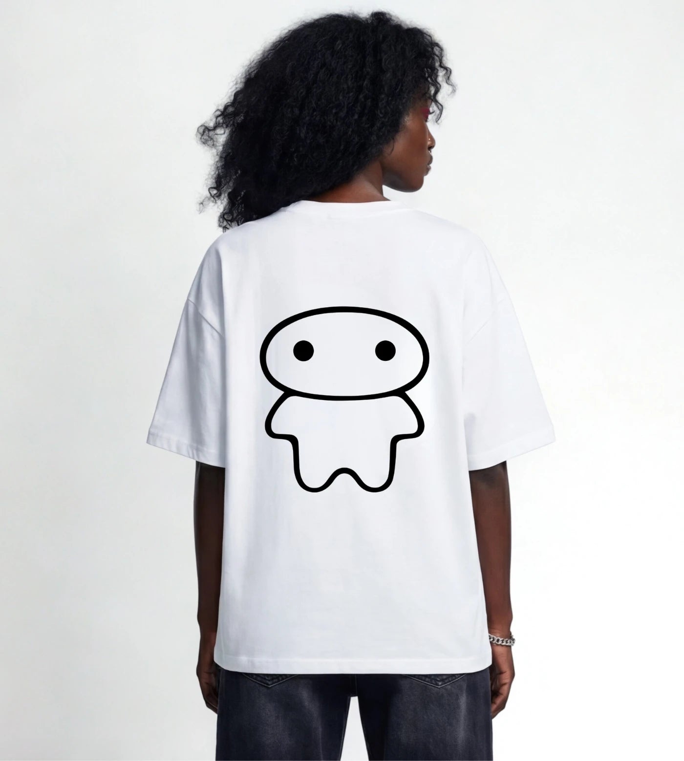 Model wears a white wide fit cotton T-shirt featuring a Lil Alien Bae back graphic. 
