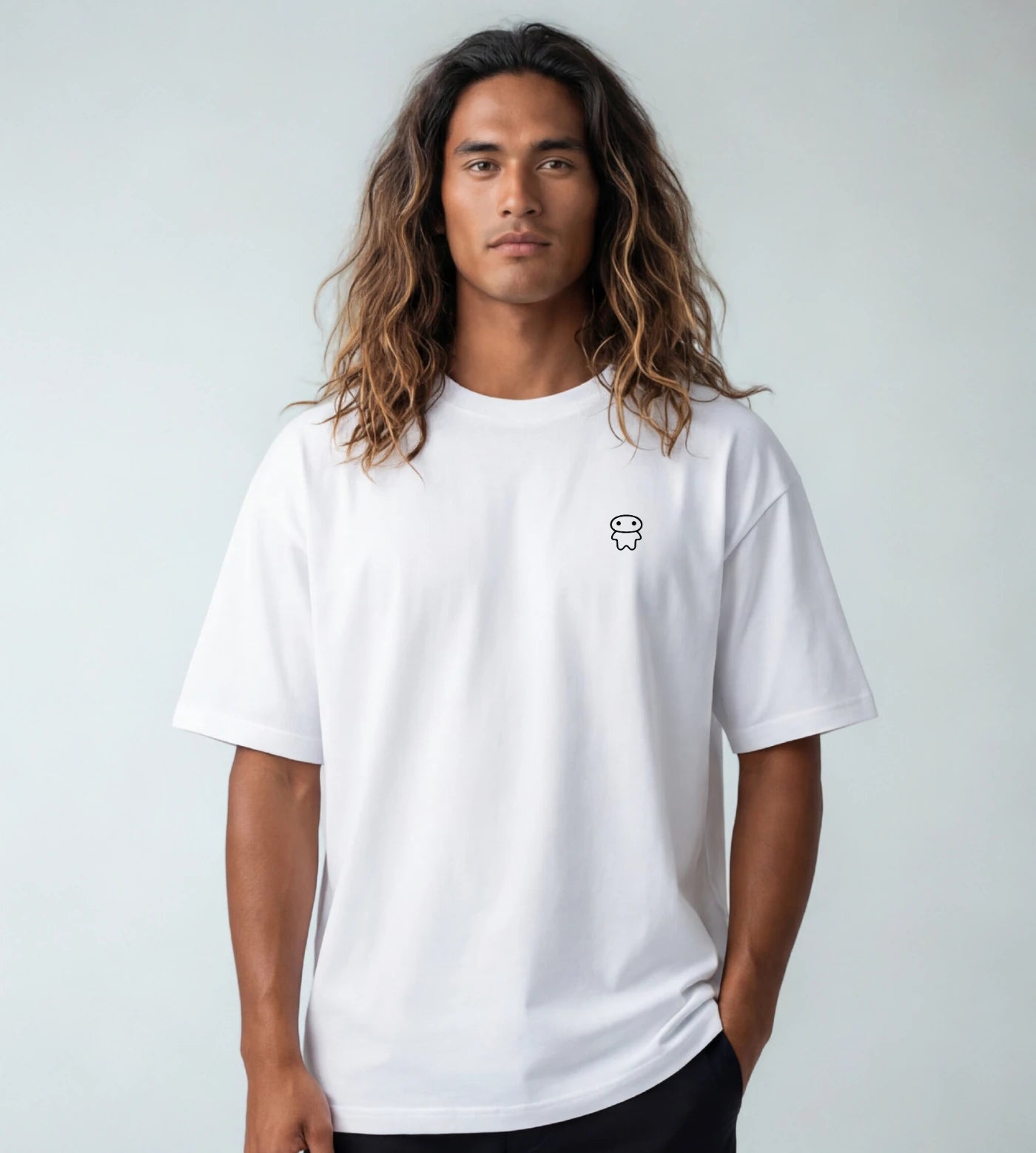 Model wears a white wide fit cotton T-shirt featuring a Lil Alien Bae chest graphic. 