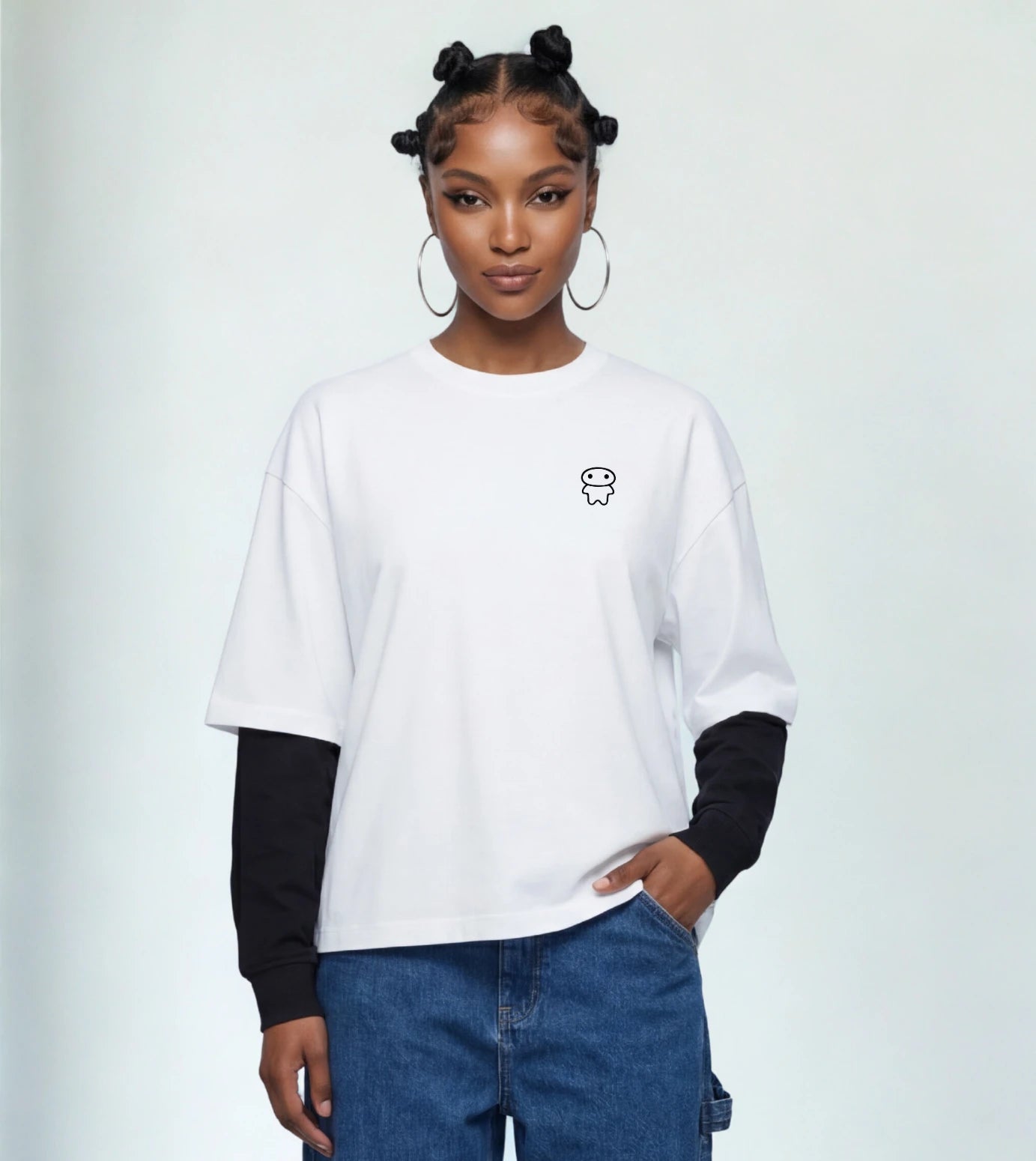 Model wears a white layered long sleeve T-shirt featuring a Lil Alien Bae chest graphic. 