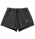 Black shorts with a small logo on a white background