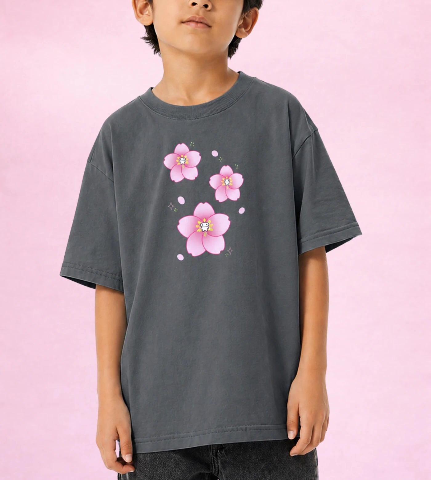 Model wears a youth gray cotton T-shirt featuring a Lil Alien Bae sakura graphic.  