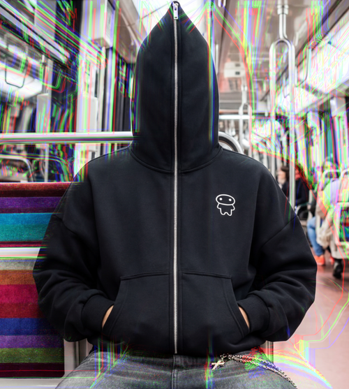 A model wears a full length zip-up graphic hoodie featuring a lil alien bae chest logo.  