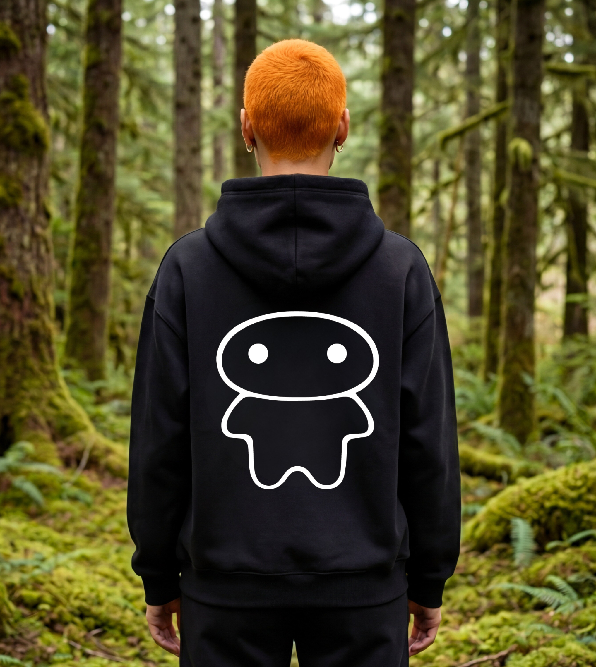 Model wearing an oversized graphic fleece hoodie with a large lil alien bae graphic on the back. 